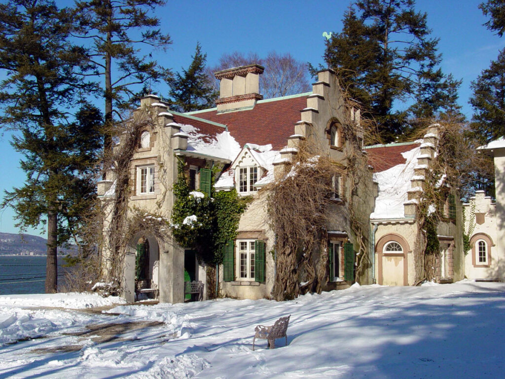 Washington Irving's Sunnyside cottage with snow on a sunny day.