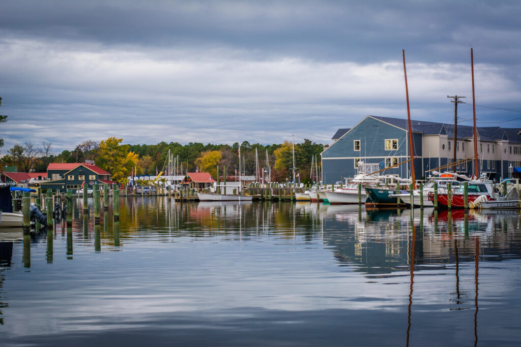 Boats and waterfront buildings at St. Michaels Harbor in Maryland during autumn.