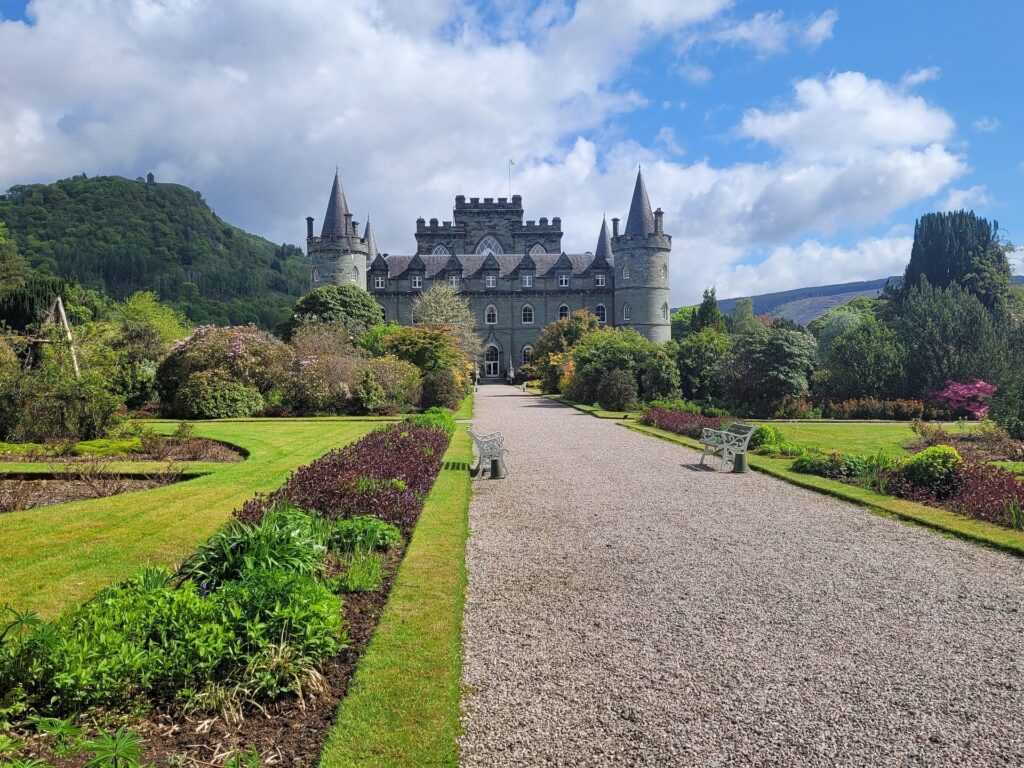 A walkway to Inveraray Castle lined with flowerbeds @ Steffie