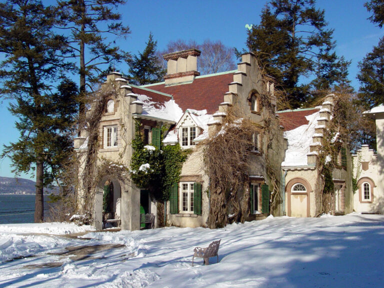 Washington Irving's Sunnyside cottage with snow on a sunny day.