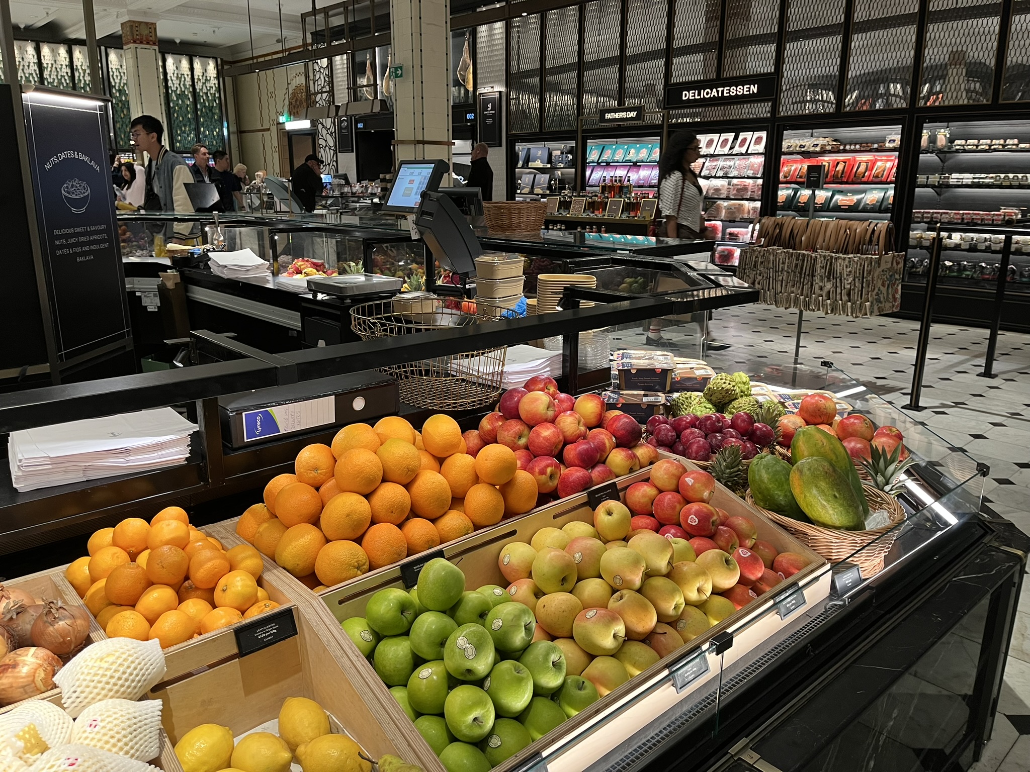 Fresh fruit displays inside Harrods Food Hall in London.