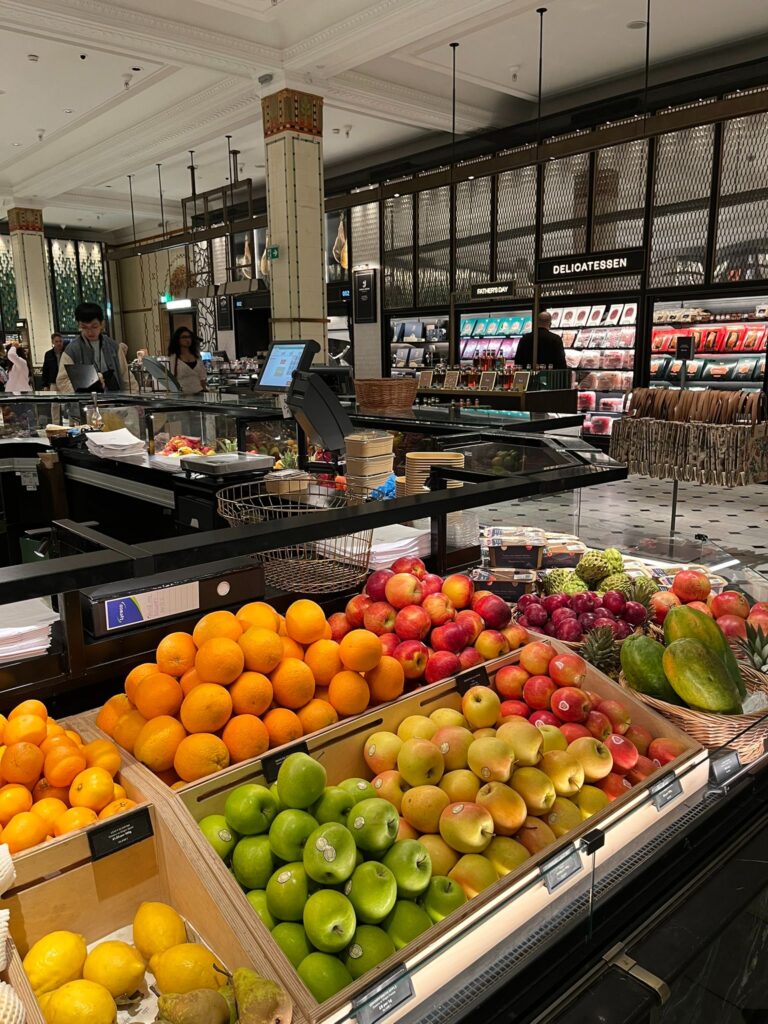Fresh fruit displays inside Harrods Food Halls in London.