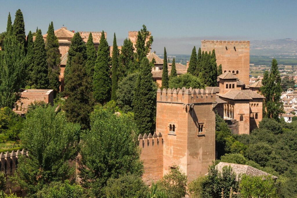 Historic towers and gardens of the Alhambra overlooking Granada, Spain.